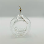 Lampada ad olio in vetro trasparente