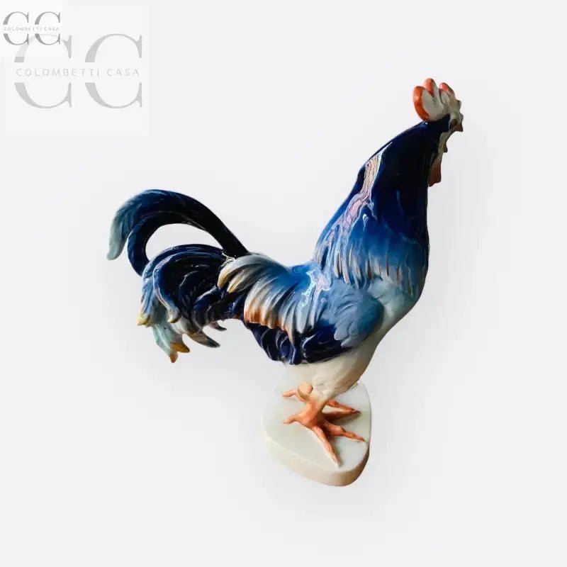 Figurina di gallo blu cobalto con dettagli dorati, ideale per collezionisti di tazze