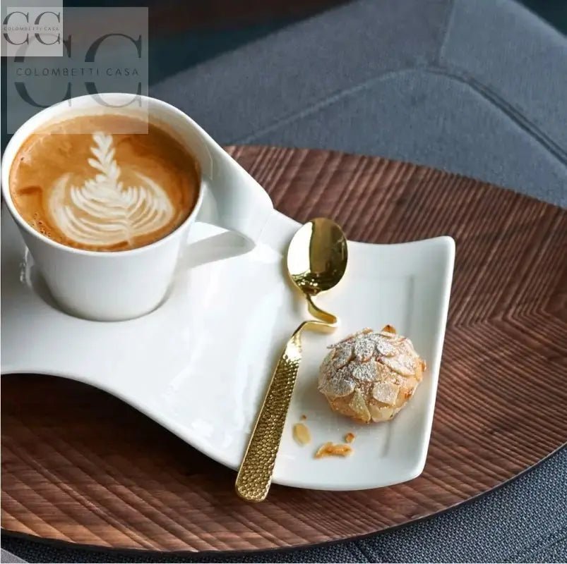 Tazza con latte art e biscotto, acciaio color oro Villeroy&Boch in stile elegante