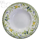 Set di piatti in porcellana Limoges con motivi floreali su ciotole bianche