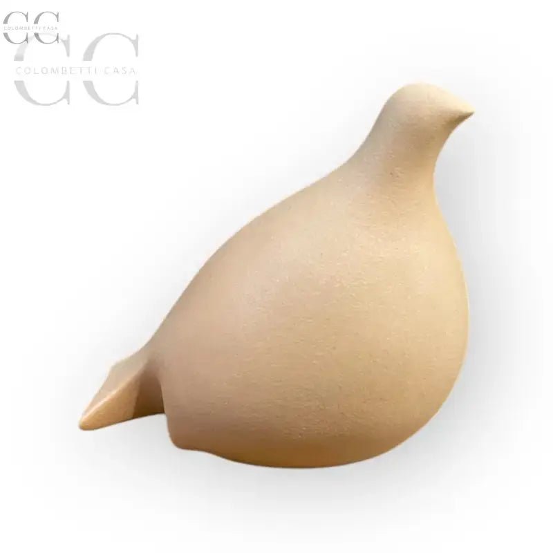 Statuina colomba stilizzata ceramica color albicocca in tonalità beige