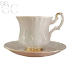 Elegante tazzina e piattino Royal Albert in porcellana bianca con bordi dorati